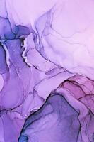 Abstract created using the technique of Alcohol ink. Macro photography of the smallest details of a panting. The panting shows how overflows of shades and colors of paint resemble space motifs. photo