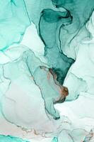 Abstract created using the technique of Alcohol ink. Macro photography of the smallest details of a panting. The panting shows how overflows of shades and colors of paint resemble space motifs. photo