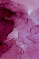Abstract created using the technique of Alcohol ink. Macro photography of the smallest details of a panting. The panting shows how overflows of shades and colors of paint resemble space motifs. photo