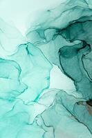 Abstract created using the technique of Alcohol ink. Macro photography of the smallest details of a panting. The panting shows how overflows of shades and colors of paint resemble space motifs. photo