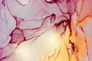 Abstract created using the technique of Alcohol ink. Macro photography of the smallest details of a panting. The panting shows how overflows of shades and colors of paint resemble space motifs. photo