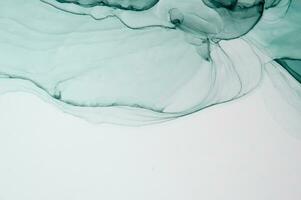 resumen creado utilizando el técnica de alcohol tinta. macro fotografía de el pequeñísimo detalles de un jadeo. el jadeo muestra cómo desborda de sombras y colores de pintar asemejarse a espacio motivos foto