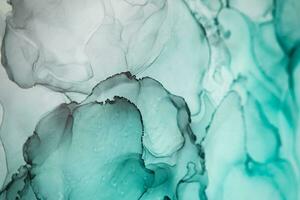 Alcohol ink sea texture. Artistic bright splash. Liquid artwork. Abstract ethereal swirl. Fragment of artwork. Trendy modern art. Inspired by the sky, as well as steam and smoke. photo