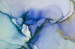Alcohol ink wash texture on white paper background. Liquid paint flow. Transparent ethereal effect. Closeup of the painting. Highly-textured colorful abstract painting background. photo