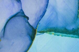 Alcohol ink wash texture on white paper background. Liquid paint flow. Transparent ethereal effect. Closeup of the painting. Highly-textured colorful abstract painting background. photo