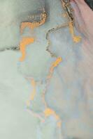 Alcohol ink wash texture on white paper background. Liquid paint flow. Transparent ethereal effect. Closeup of the painting. Highly-textured colorful abstract painting background. photo