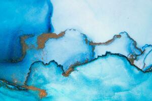 The picture is painted in alcohol ink. Abstraction will perfectly fit into a modern interior. Closeup of the painting. Colorful abstract painting background. photo