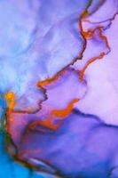 The picture is painted in alcohol ink. Abstraction will perfectly fit into a modern interior. Closeup of the painting. Colorful abstract painting background. photo