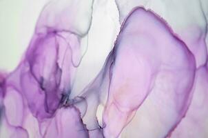 Abstract created using the technique of Alcohol ink. Macro photography of the smallest details of a panting. The panting shows how overflows of shades and colors of paint resemble space motifs. photo