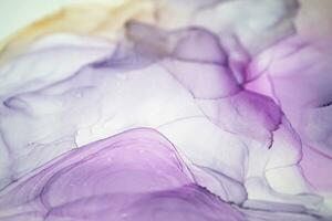 Abstract created using the technique of Alcohol ink. Macro photography of the smallest details of a panting. The panting shows how overflows of shades and colors of paint resemble space motifs. photo