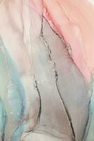 Painting created with alcohol ink. Soft smooth color transitions combined with clear gold and silver edges. Blue, pink, green abstract color combination. photo