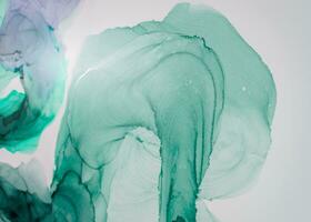 Ink colors are amazingly bright, luminous, translucent, free-flowing, and dry quickly. Abstract artwork. Trendy wallpaper. Natural pattern, luxury. Art for your design project. Transparent creativity. photo