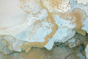 Alcohol ink sea texture. Artistic bright splash. Liquid artwork. Abstract ethereal swirl. Fragment of artwork. Trendy modern art. Inspired by the sky, as well as steam and smoke. photo