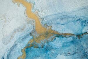 Alcohol ink sea texture. Artistic bright splash. Liquid artwork. Abstract ethereal swirl. Fragment of artwork. Trendy modern art. Inspired by the sky, as well as steam and smoke. photo
