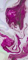 Abstract created using the technique of liquid acrylic. Macro photography of the smallest details of a picture. The picture shows how overflows of shades and colors of paint resemble space motifs. photo