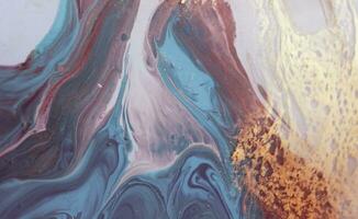 Abstract created using the technique of liquid acrylic. Macro photography of the smallest details of a panting. The panting shows how overflows of shades and colors of paint resemble space motifs. photo