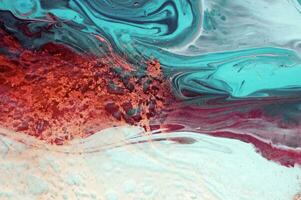 Abstract created using the technique of liquid acrylic. Macro photography of the smallest details of a panting. The panting shows how overflows of shades and colors of paint resemble space motifs. photo