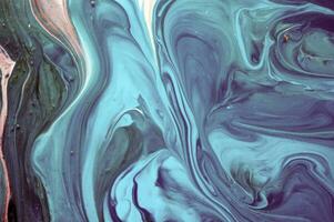 Abstract created using the technique of liquid acrylic. Macro photography of the smallest details of a panting. The panting shows how overflows of shades and colors of paint resemble space motifs. photo