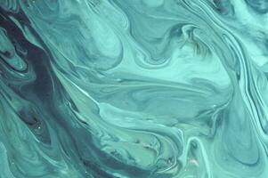 Abstract created using the technique of liquid acrylic. Macro photography of the smallest details of a panting. The panting shows how overflows of shades and colors of paint resemble space motifs. photo