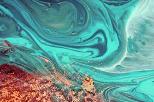 Abstract created using the technique of liquid acrylic. Macro photography of the smallest details of a panting. The panting shows how overflows of shades and colors of paint resemble space motifs. photo