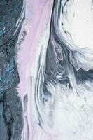 Abstract created using the technique of liquid acrylic. Macro photography of the smallest details of a picture. The picture shows how overflows of shades and colors of paint resemble space motifs. photo