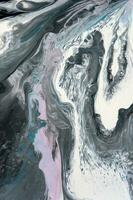 Abstract created using the technique of liquid acrylic. Macro photography of the smallest details of a picture. The picture shows how overflows of shades and colors of paint resemble space motifs. photo