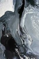 Abstract created using the technique of liquid acrylic. Macro photography of the smallest details of a picture. The picture shows how overflows of shades and colors of paint resemble space motifs. photo