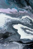 Abstract created using the technique of liquid acrylic. Macro photography of the smallest details of a picture. The picture shows how overflows of shades and colors of paint resemble space motifs. photo