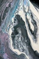Abstract created using the technique of liquid acrylic. Macro photography of the smallest details of a picture. The picture shows how overflows of shades and colors of paint resemble space motifs. photo