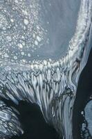 Abstract created using the technique of liquid acrylic. Macro photography of the smallest details of a picture. The picture shows how overflows of shades and colors of paint resemble space motifs. photo