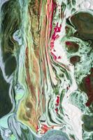 Abstract created using the technique of liquid acrylic. Macro photography of the smallest details of a picture. The picture shows how overflows of shades and colors of paint resemble space motifs. photo