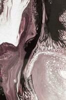 Abstract created using the technique of liquid acrylic. Macro photography of the smallest details of a picture. The picture shows how overflows of shades and colors of paint resemble space motifs. photo