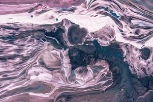 Abstract created using the technique of liquid acrylic. Macro photography of the smallest details of a picture. The picture shows how overflows of shades and colors of paint resemble space motifs. photo