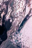 Abstract created using the technique of liquid acrylic. Macro photography of the smallest details of a picture. The picture shows how overflows of shades and colors of paint resemble space motifs. photo