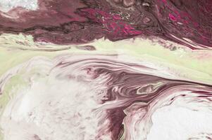 Abstract created using the technique of liquid acrylic. Macro photography of the smallest details of a picture. The picture shows how overflows of shades and colors of paint resemble space motifs. photo