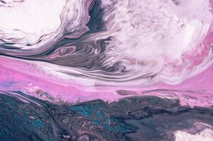 Abstract created using the technique of liquid acrylic. Macro photography of the smallest details of a picture. The picture shows how overflows of shades and colors of paint resemble space motifs. photo