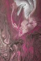 Abstract created using the technique of liquid acrylic. Macro photography of the smallest details of a picture. The picture shows how overflows of shades and colors of paint resemble space motifs. photo
