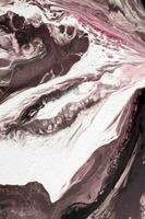 Abstract created using the technique of liquid acrylic. Macro photography of the smallest details of a picture. The picture shows how overflows of shades and colors of paint resemble space motifs. photo