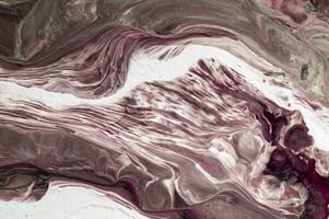 Abstract created using the technique of liquid acrylic. Macro photography of the smallest details of a picture. The picture shows how overflows of shades and colors of paint resemble space motifs. photo