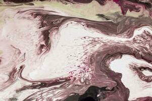 Abstract created using the technique of liquid acrylic. Macro photography of the smallest details of a picture. The picture shows how overflows of shades and colors of paint resemble space motifs. photo