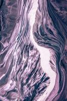 Abstract created using the technique of liquid acrylic. Macro photography of the smallest details of a picture. The picture shows how overflows of shades and colors of paint resemble space motifs. photo