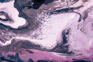 Abstract created using the technique of liquid acrylic. Macro photography of the smallest details of a picture. The picture shows how overflows of shades and colors of paint resemble space motifs. photo