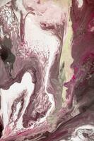 Abstract created using the technique of liquid acrylic. Macro photography of the smallest details of a picture. The picture shows how overflows of shades and colors of paint resemble space motifs. photo