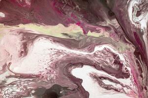 Abstract created using the technique of liquid acrylic. Macro photography of the smallest details of a picture. The picture shows how overflows of shades and colors of paint resemble space motifs. photo