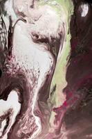 Abstract created using the technique of liquid acrylic. Macro photography of the smallest details of a picture. The picture shows how overflows of shades and colors of paint resemble space motifs. photo