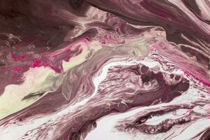 Abstract created using the technique of liquid acrylic. Macro photography of the smallest details of a picture. The picture shows how overflows of shades and colors of paint resemble space motifs. photo