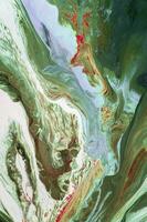 Abstract created using the technique of liquid acrylic. Macro photography of the smallest details of a picture. The picture shows how overflows of shades and colors of paint resemble space motifs. photo