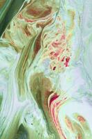 Abstract created using the technique of liquid acrylic. Macro photography of the smallest details of a picture. The picture shows how overflows of shades and colors of paint resemble space motifs. photo