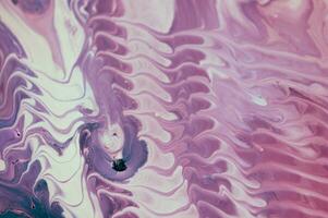 Abstract fluid acrylic painting. Marbled blue abstract background. Liquid marble pattern. Hand painted background with mixed liquid red, blue and green paints. Modern art. photo
