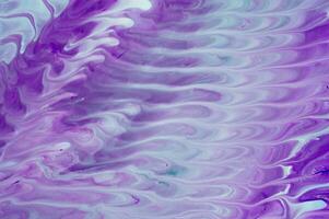 Abstract fluid acrylic painting. Marbled blue abstract background. Liquid marble pattern. Hand painted background with mixed liquid red, blue and green paints. Modern art. photo